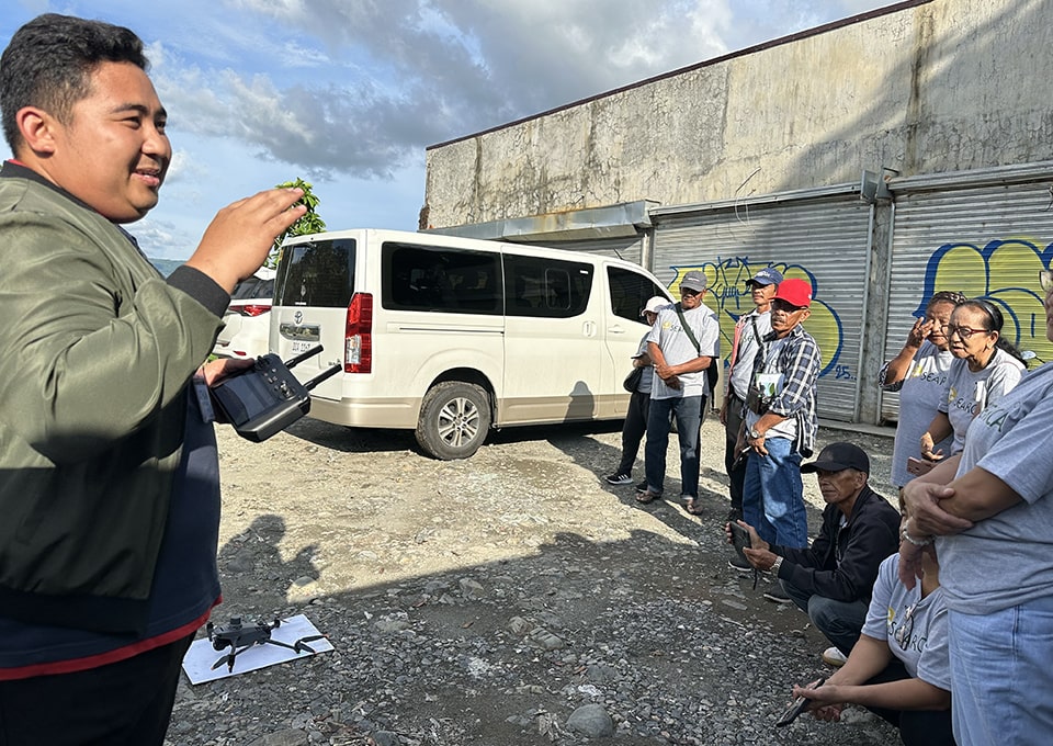 Mr. Montecillo demonstrates how to map a paddy field using a drone.