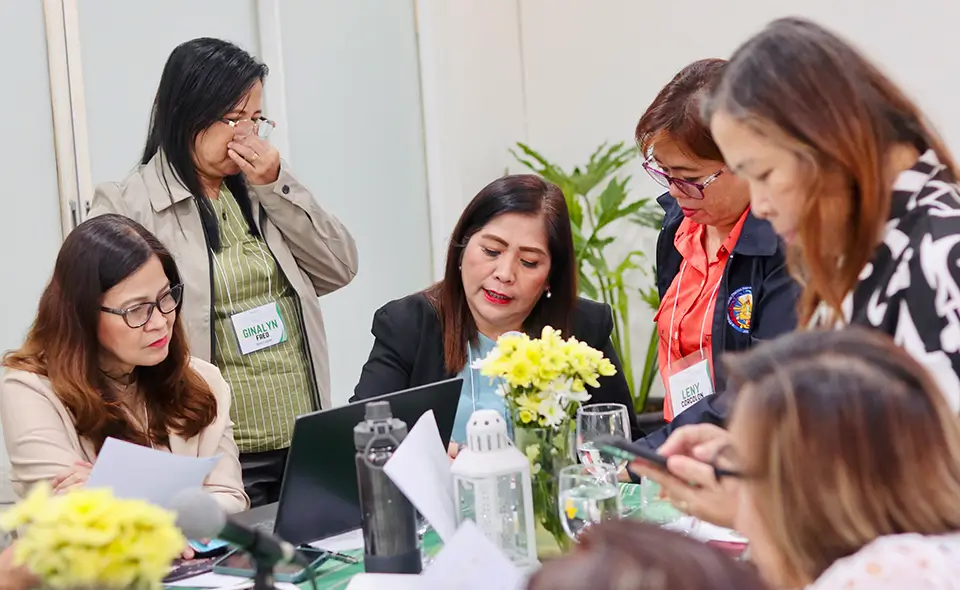 Participants from DepEd Laguna Division actively discuss refinements of the M&E tool.