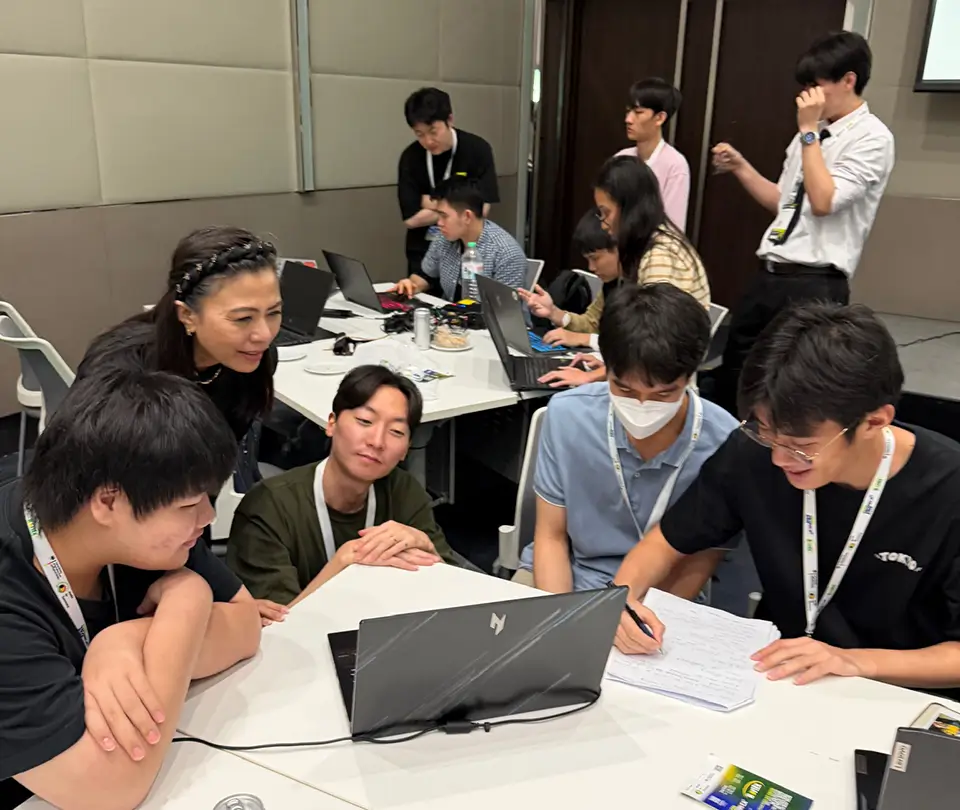 SEARCA Emerging Innovation for Growth Department representative Lichelle Carlos (leftmost, standing) previews the AI-based prototypes created in Agritechnica Asia Hackathon