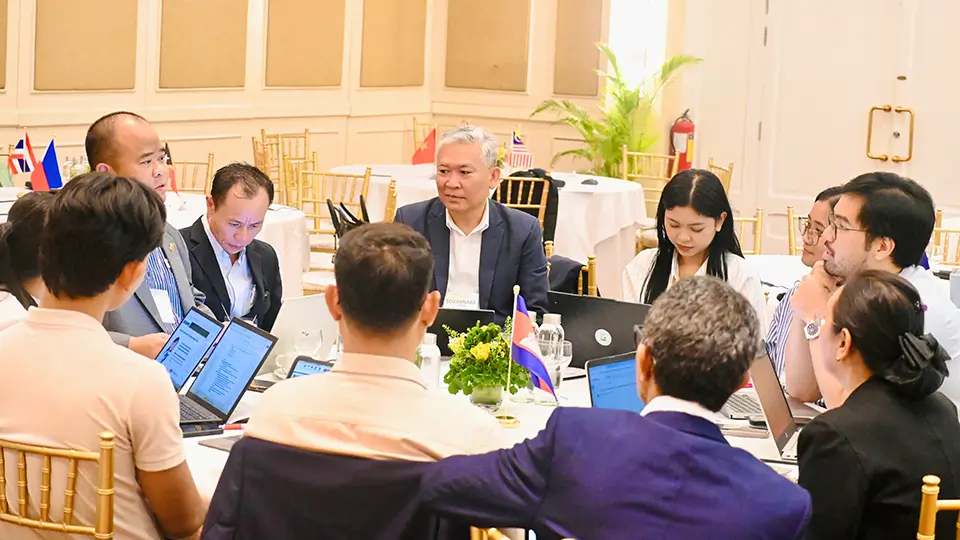 Delegates from ASEAN Member States who are experts in education, nutrition, and policy analyze national school meal data and cross-border procurement strategies during a workshop breakout session in Phnom Penh, Cambodia.