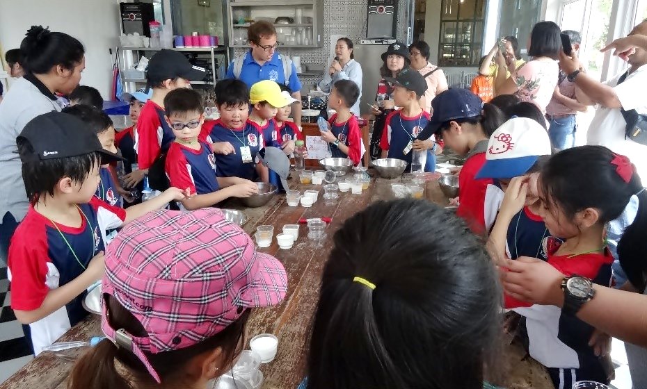 Participants watch students from an international school in Thailand undergo workshop on ice cream making using buffalo milk at the Mini Murrah Farm in Chachoengsao Province.