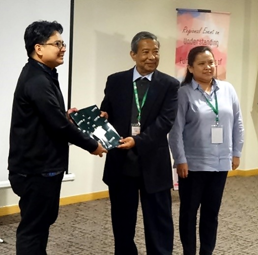 Ir. Dzulkifly Mat Hashim of UPM (center) receives a token of appreciation from Dr. Pedcris Orencio, Program Head of SEARCA's Research and Development Department, and Dr. Cuaresma.