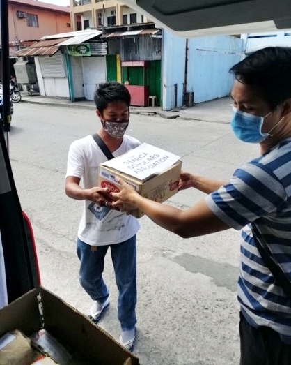 SEARCA scholars doing their part to help the Los Baños community during the Enhanced Community Quarantine in the Philippines.