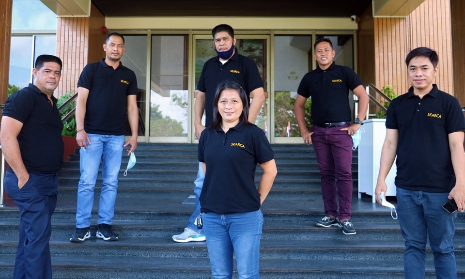 Mary Ann P. Bautista (front and center), lone female SEARCA driver, together with the other SEARCA drivers.