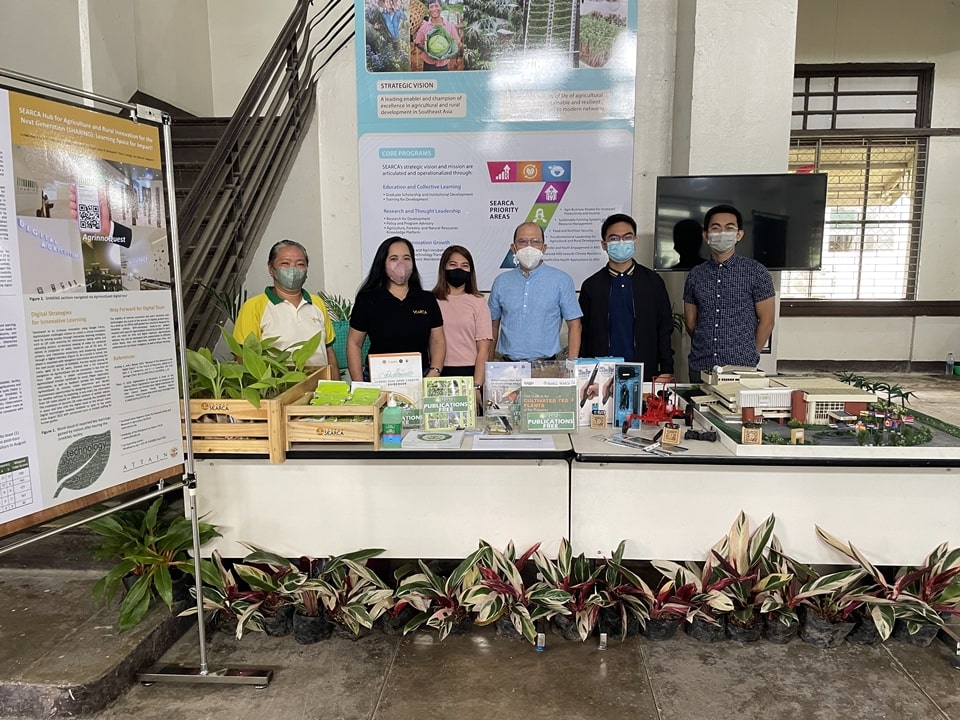 Dr. Glenn B. Gregorio (third from right), SEARCA Director, with SEARCA staff and personnel who man the SEARCA booth in the Alumni Trade Fair and Exhibit.