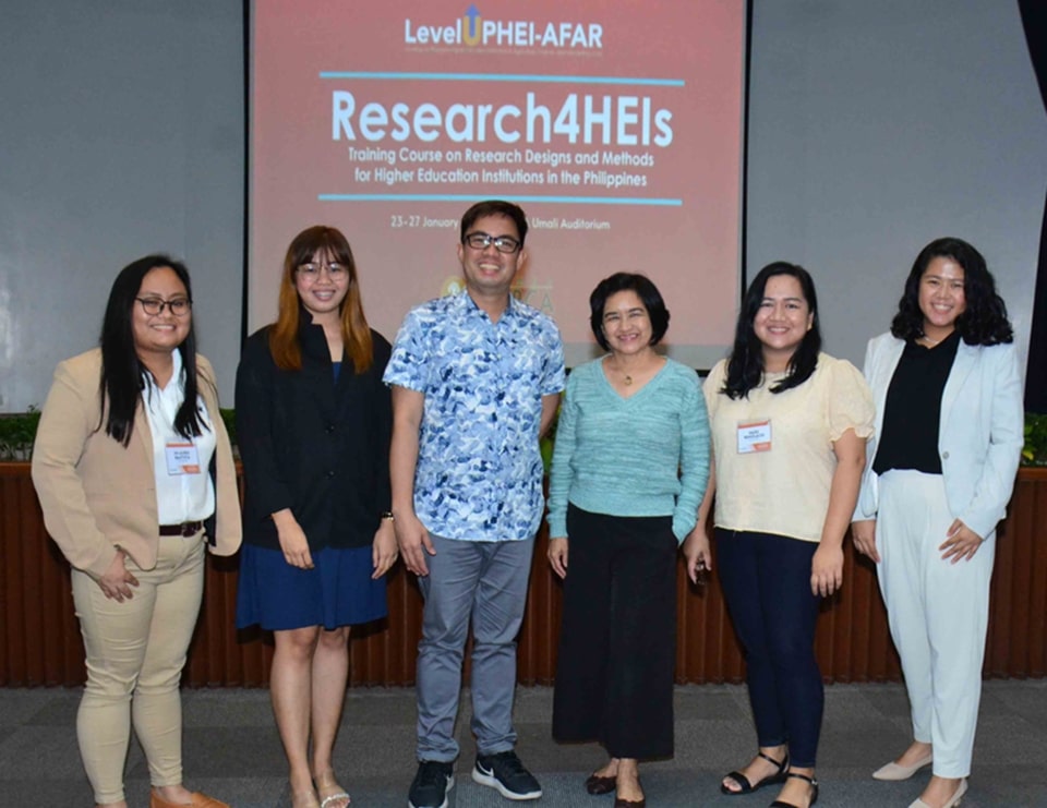 Dr. Maria Ana Quimbo (4th from left), Training Course on Research4HEIs Technical Coordinator and Lead Faculty, pose for a photo with the Resource Persons from UPLB, namely (L-R): Ms. Mi-Auree Bautista, Ms. Lysette Aguila, Dr. Mark Oliver Llangco, Ms. Hazel Remolacio, and Asst. Prof. Angelyn Mananghaya.