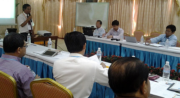 Dr. Men Sarom (standing), SEARCA National Team Leader for Cambodia, providing a presentation on the methodology and selection criteria for good adaptation practices