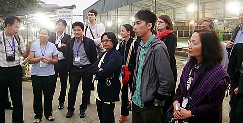 GREASE scientific seminar participants visit Hanoi’s swine abattoir after the seminar.