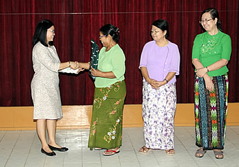 Dr. Bessie Burgos presenting tokens to the SFRT Grantees