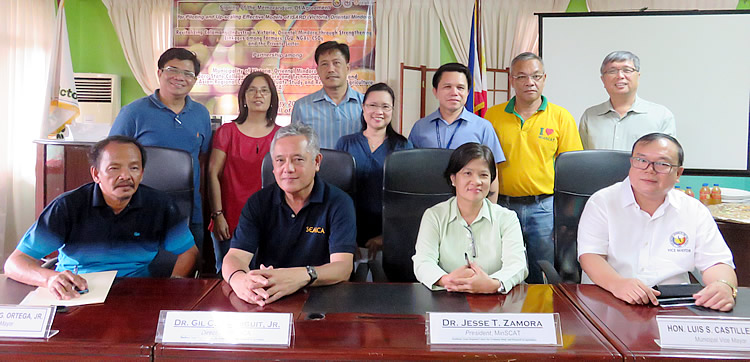 Project Steering Committee Members [br] L-R front row: Mayor Alfredo G. Ortega, Jr. (LGU), Dr. Gil C. Saguiguit, Jr. (SEARCA), Dr. Ma. Concepcion L. Mores (MinSCAT), Vice Mayor Luis S. Castillet, Sr. [br] L-R back row: Mr. Pat Andrew Barrientos (DA-ATI), Ms. Marissa Luna (DA-RFU), Mr. Bernardino Atienza, Jr. (NEDA-4B), Dr. Bessie M. Burgos (SEARCA), Mr. Arnel Hutalla (DTI), Dr. Levy Arago, Jr. (MinSCAT), Prof. Rolando T. Bello (SEARCA)