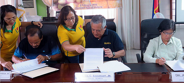 MOA Signing - L-R: Mayor Alfredo G. Ortega, Jr. (LGU), Dr. Gil C. Saguiguit, Jr. (SEARCA), Dr. Ma. Concepcion L. Mores (MinSCAT)