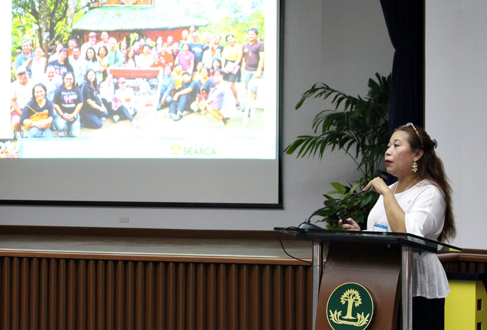 Ms. Gigi Pontejos-Morris, Owner of MoCA Family Farm RLearning Center in Padre Garcia, Batangas, updates participants on practices and challenges of farm tourism in the Philippines, showing a photo of dedicated farm tourism pioneers when they first banded together to advance their cause.