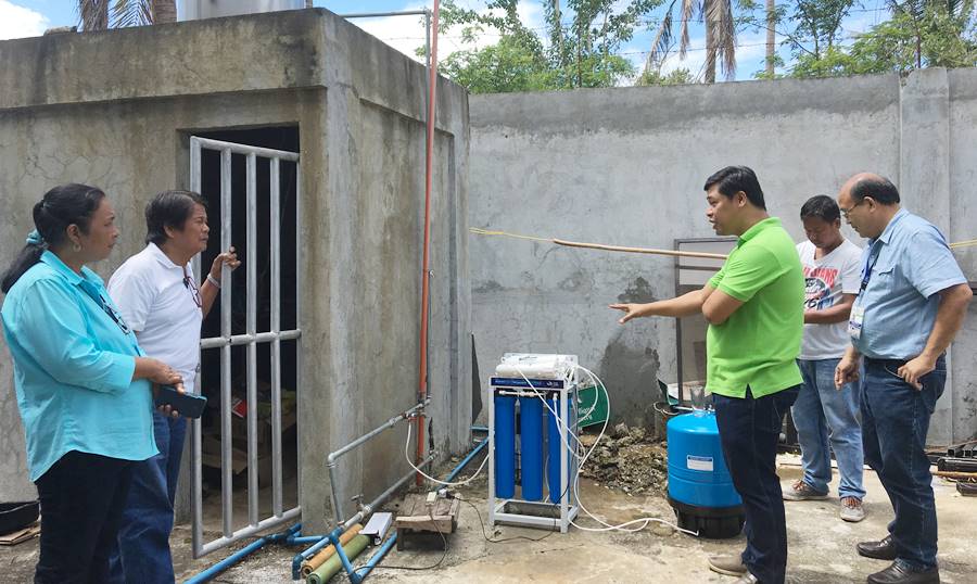 L-R: Ms. Edelina Rellin, Senior Science Research Specialist, PCC CSU; Mr. Nestor Bautista, Chairman, CAVAFEDCO; Mr. Joel Domingo, Manager of La Charisse Enterprise; and Dr. Franklin Rellin, Center Director, PCC CSU during the product demonstration of water distillers distributed to CBED cooperatives on March 2, 2017 at Namballan Norte, Tuguegarao City, Cagayan.