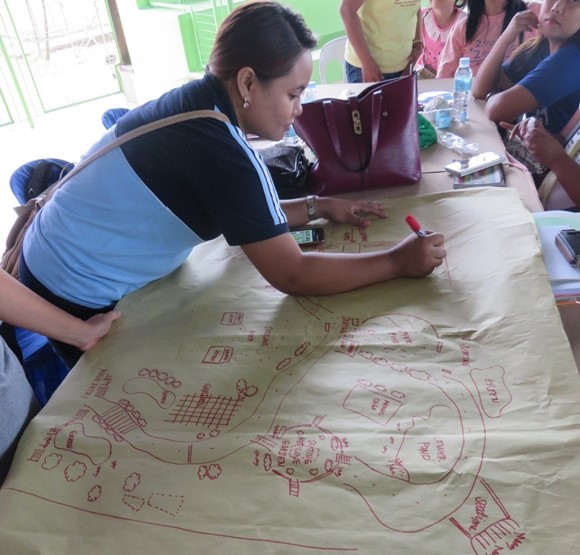Participants from the Schools District of Sta. Cruz preparing their school garden layout.