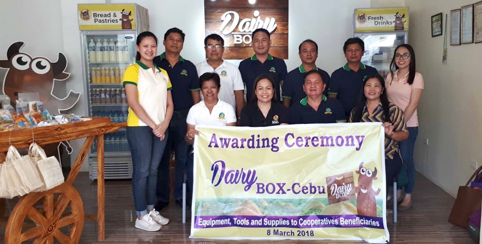 Seated from left: Ms. Maria Elena Limocon, General Manager of LAMAC MPC; Ms. Nancy Landicho, SEARCA Program Specialist and OIC; Mr. Delfin Tuguib, Chairman of LAMAC MPC; and Ms. Guillerma Abay-abay, PCC USF CBED Coordinator. Standing are LAMAC Board Members together with Ms. Sarah Grace Quiñones, SEARCA Project Coordinator (leftmost) and Ms. Marie Cris Mendoza, SEARCA Property and Supply Assistant (rightmost).