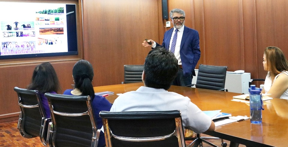 Dr. Marcellus M. Caldas (standing), Professor and Assistant Provost of International Faculty Collaboration and Educational Programs at Kansas State University (K-State), gives a presentation about K-State to SEARCA officials during his visit to the Center on 23 October 2018.