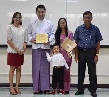 Speech Prof. Kristine Adalla (left) and CAS Dean and LITE Manager Dr. Felino Lansigan (right-most) handed the certificates to  Mr. Zaw Win Kyaw as he received his certificate, with his wife and three-year old son (center).